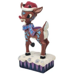 Jim Shore - Rudolph Traditions- Lighted Rudolph With Santa Hat -Christmas Discount Store 518340 Jim Shore Rudolph Traditions Lighted Rudolph With Santa Hat angled left 06353.1649876744