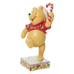 Jim Shore - Disney Traditions - Pooh Christmas Candy Cane Figurine -Christmas Discount Store Jim Shore Disney Traditions Pooh Christmas Candy Cane Figurine front 19496.1683301907